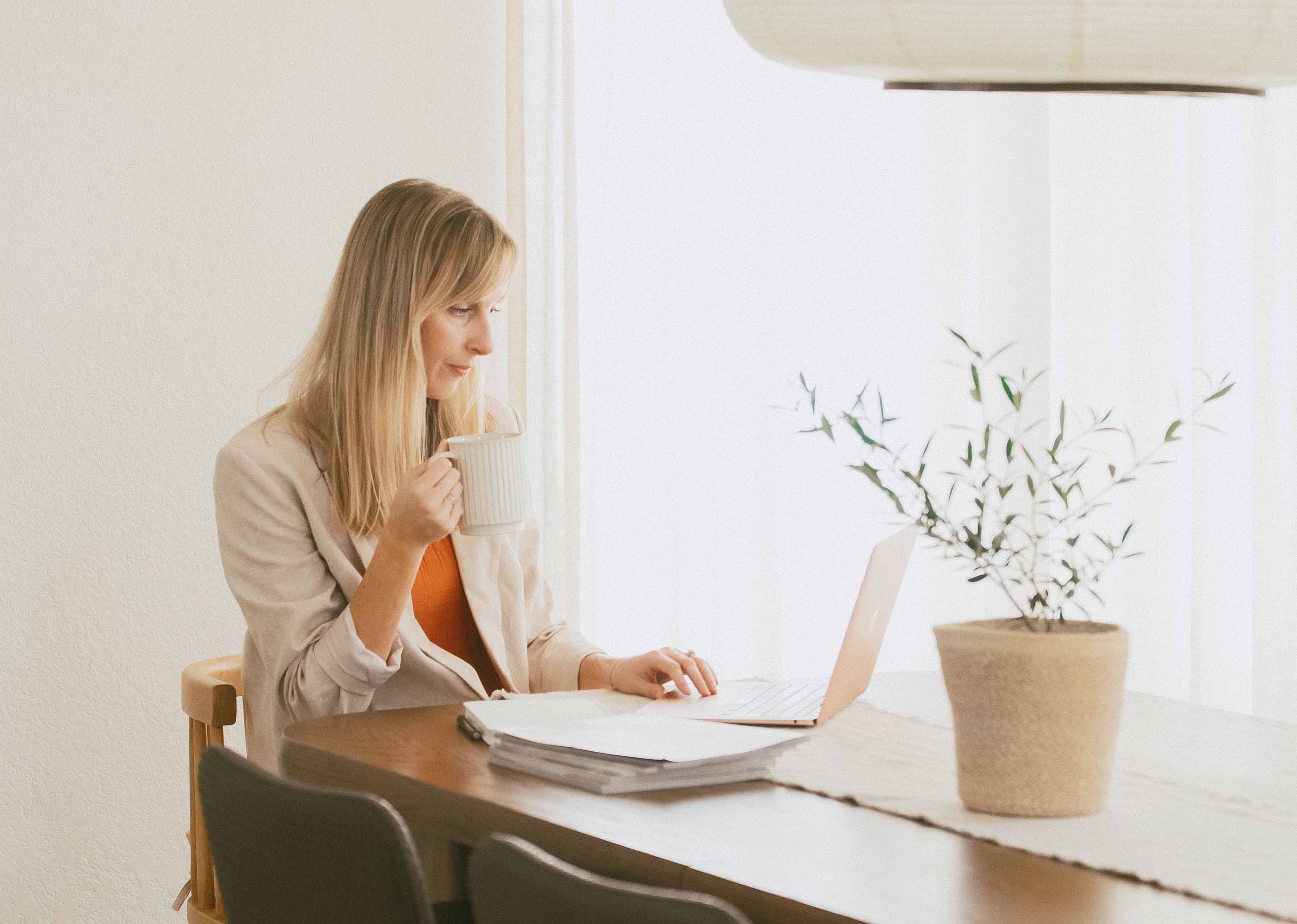 Kristin Aldridge working at her desk with Morning Notes Collective