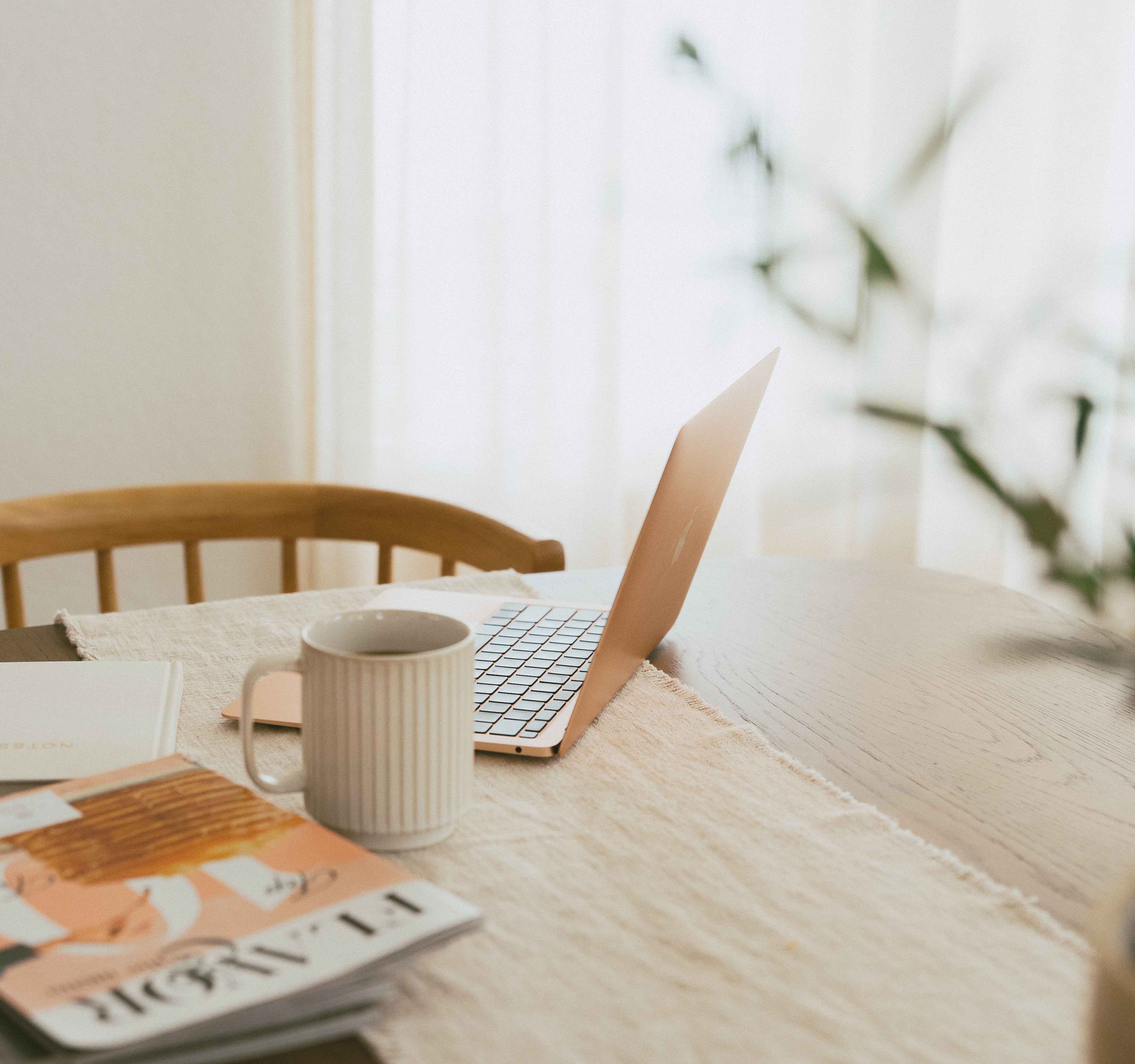 Magazine open on desk with coffee